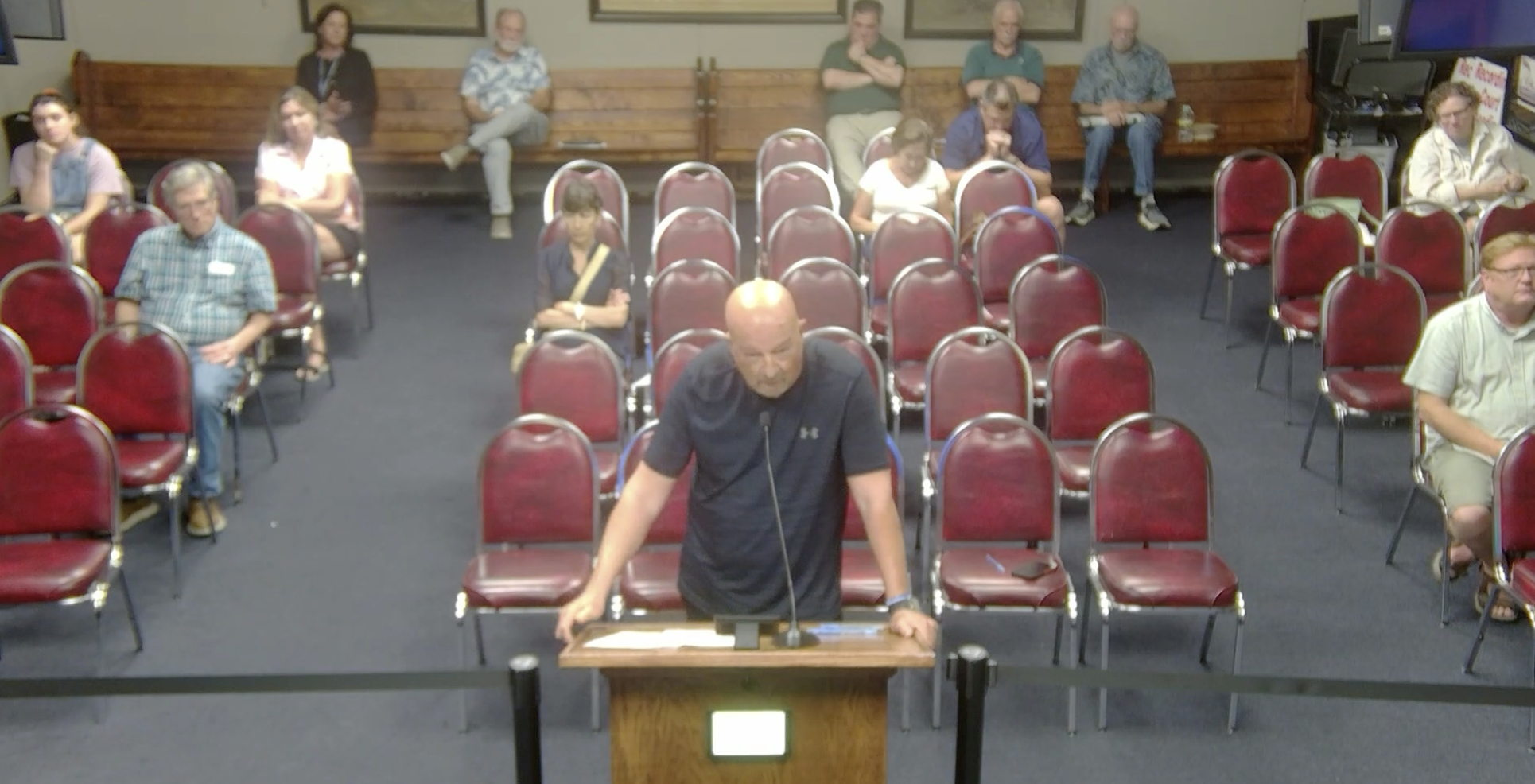 David J. Mancina addresses the City Council during public comment on water and sewer rates. (City of Mandeville)