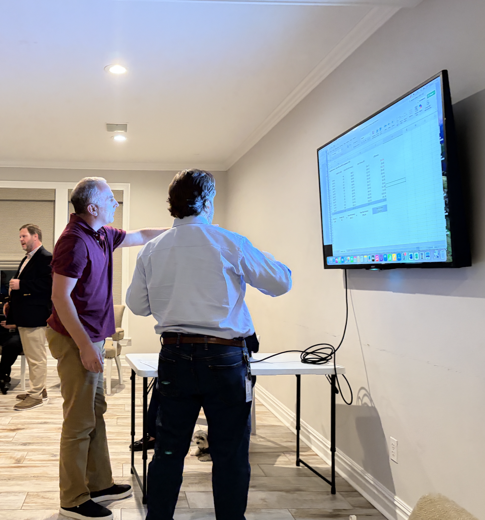 District II Councilman Kevin Vogeltanz demonstrates a water and sewer rate calculator he created in Microsoft Excel (Mandeville Daily)